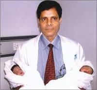 Doctor and baby Doctor holding baby
